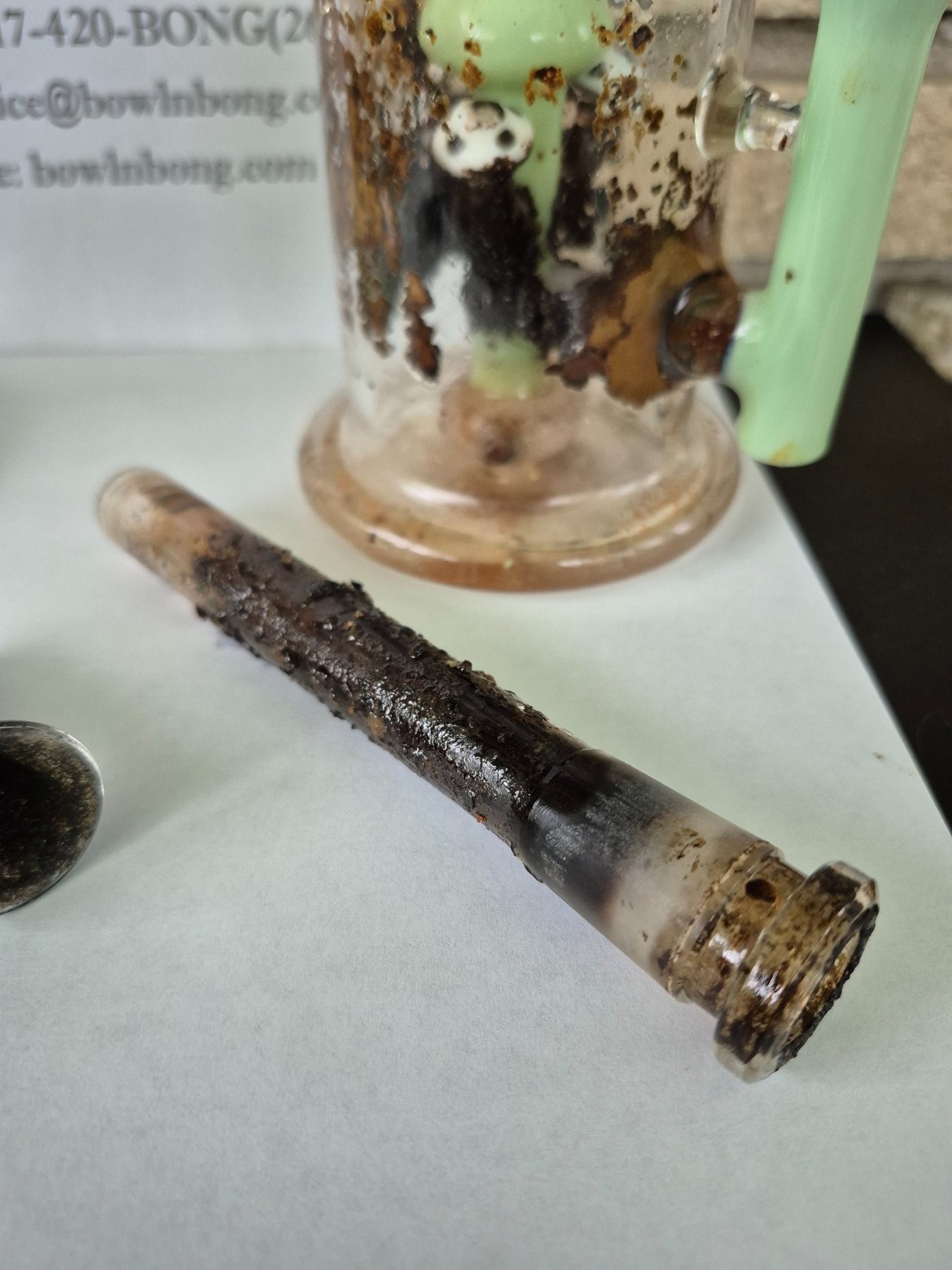 Dirty glass downstem before cleaning